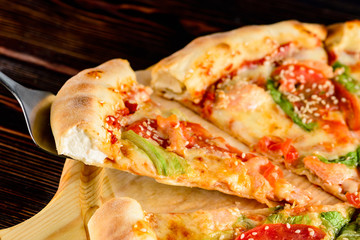 slice of pizza close-up on a spatula