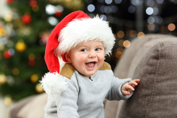 Joyful baby looking at camera in christmas