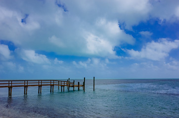 Fototapeta na wymiar Wooden pier extending into the sea in Florida, USA