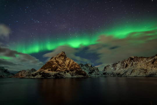 Northern Lights in the mountains of Reine, Norway. Lofoten Islands © nick