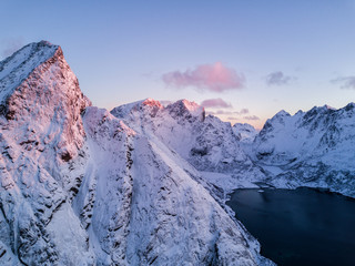 Fototapeta premium Aerial drone photo - Beautiful sunrise over the mountains of the Lofoten Islands. Reine, Norway