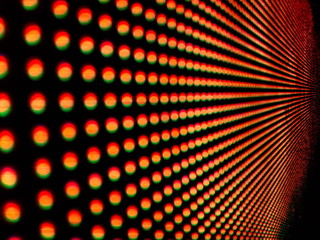 Background of colorful luminous circles, close-up of a led screen.