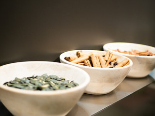 Bowl of Cinnamon standing on a modern kitchen shelf