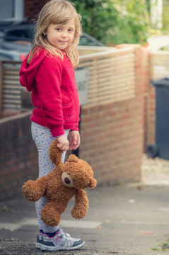 Adorable Girl Holding Teddy Bear