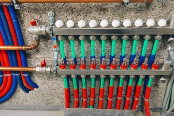 manifold collector with pipes of underfloor heating system