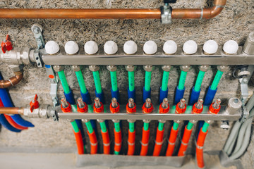 manifold collector with pipes of underfloor heating system