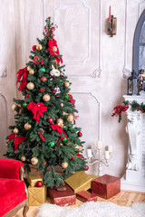 Beautiful holiday decorated room with Christmas tree, fireplace and with presents. Cozy winter scene. White interior. Christmas Nutcracker