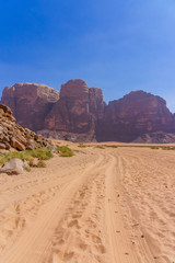 Red mountains of Wadi Rum desert in Jordan. Wadi Rum also known as The Valley of the Moon is a valley cut into the sandstone and granite rock in southern Jordan to the east of Aqaba