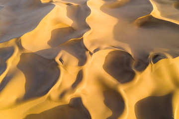 Fototapeta na wymiar golden sand dunes background texture