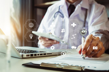 medical technology concept,smart doctor hand working with modern laptop computer in modern office with virtual icon diagram