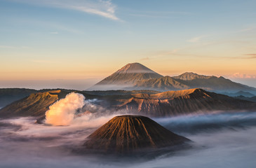 Mount Bromo volcano (Gunung Bromo), and Batok during sunrise from viewpoint on Mount Penanjakan, in East Java, Indonesia. Early morning.