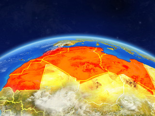Maghreb region on planet Earth with country borders and highly detailed planet surface and clouds.