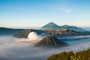 Mount Bromo volcano (Gunung Bromo), and Batok during sunrise from viewpoint on Mount Penanjakan, in East Java, Indonesia. Early morning.