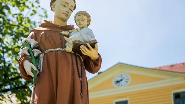 "Statue of Saint Anthony holding baby Jesus at Maria Radna Franciscan Monastery Lipova, Arad county, Romania. Maria Radna, the most significant place of pilgrimage in south-eastern Europe. Magic Lante