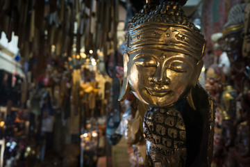 Fototapeta na wymiar Golden Human Mask Displayed In A Gallery