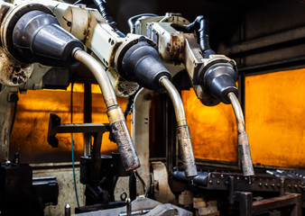 Fototapeta na wymiar Robots welding team in the automotive parts industry