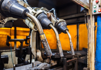 Fototapeta premium Robots welding team in the automotive parts industry