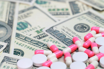 medicine on money background .