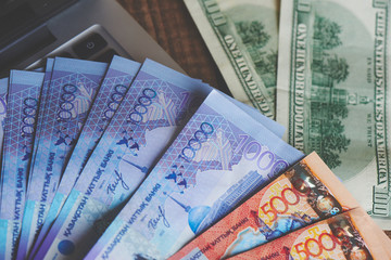 Dollars and tenge on the laptop. Money of Kazakhstan. Business..