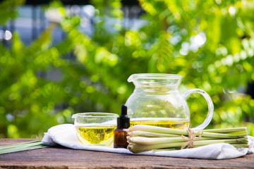 Lemongrass essential oil is placed on the table using a hand-drip oil lemongrass oil - spa and insect repellent.
