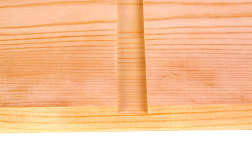 Close-up of a board with a woodworking dado groove isolated