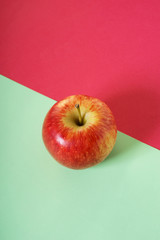 red apple with color background