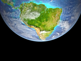South America from space. Very high detail of Earth surface with visible mountains and shallow seas.