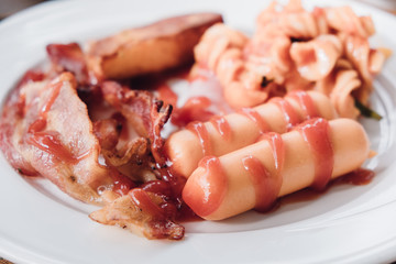 Ham sausage egg. A sausage is a cylindrical meat product usually made from ground meat, often pork, beef or veal, along with salt, spices and other flavourings and breadcrumbs.