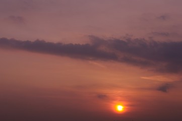 The sunset sky background with sunlight for the dusk moment in the evening. Photo has space for text.