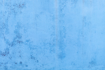 Blue concrete wall with water marks running down