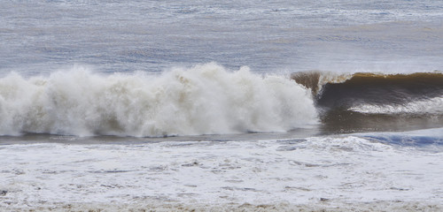 Fototapeta premium Brown Storm Surge Surfing Waves