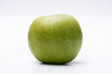 Green apple with white background close up