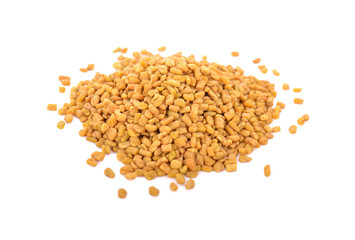 pile of dry fenugreek seeds on white background