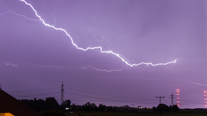 Naklejka na ściany i meble Thunderstorm with lightning near Aholming - Bavaria - Germany