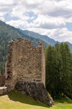 Remains of the olld Ruined Castle Andraz in the Italian Dolomite Mountains. Summer afternoon of 2018.
