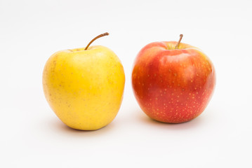 Ripe yellow and red apples isolated on white background