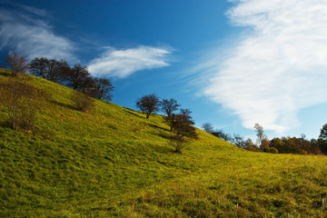 Fototapeta na wymiar Rural countryside landscape with hills