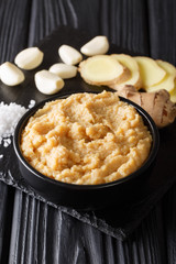 Ginger and Garlic paste or Adrak Lahsun puree closeup on table. vertical