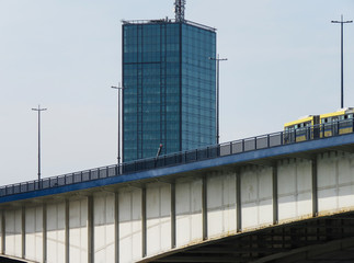 Bridge on Sava river with skyscraper in the background