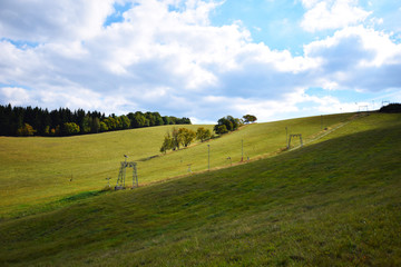 landscape with green field and blue sky