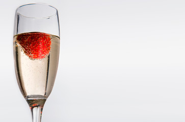 Glasses with white wine and strawberry