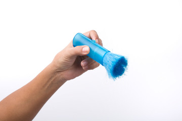 Hand with blue cleaning brush