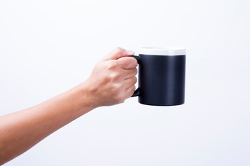 Woman hands holding coffee mug on white