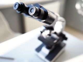 Scientific binocular view magnifier workspace room closeup