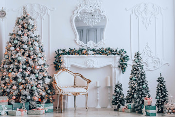 Christmas and New Year's elegant decor tree with gifts and vintage armchair