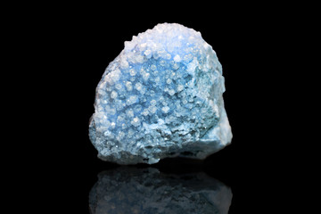 Blue drusa mineral calcite on a black background