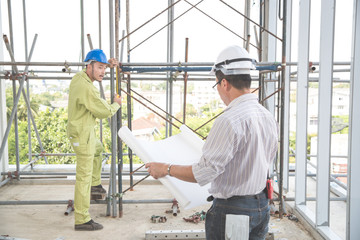 engineering man working from back view  at construction site