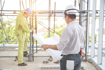 engineering man working from back view  at construction site