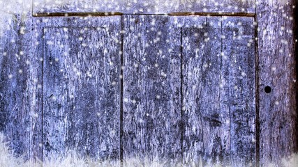 ice frozen door with falling snowflakes