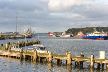 The old fishing port of the seaside resort Sassnitz with a lot of twin hull ships in the harbor